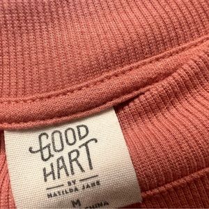 Coral blouse with light sweater like quality. Great accents. Good Hart brand.